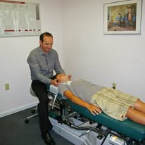Dr. Cary Najarian performing a chiropractic adjustment