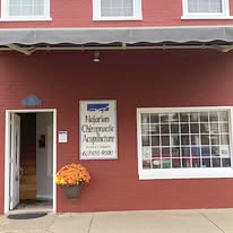 Office exterior in fall with mums