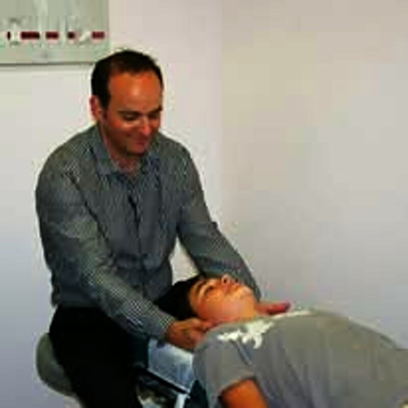 Dr. Najarian adjusting a patient's neck