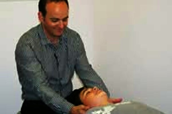 Dr. Najarian treating a patient