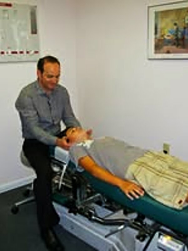 Dr. Najarian performing a chiropractic adjustment